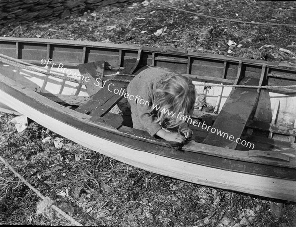 CHILD MENDING ROW BOAT